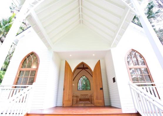 a white church with arched doors