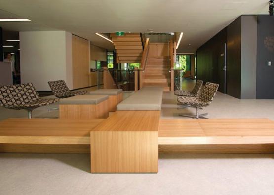 a long wooden bench in a room