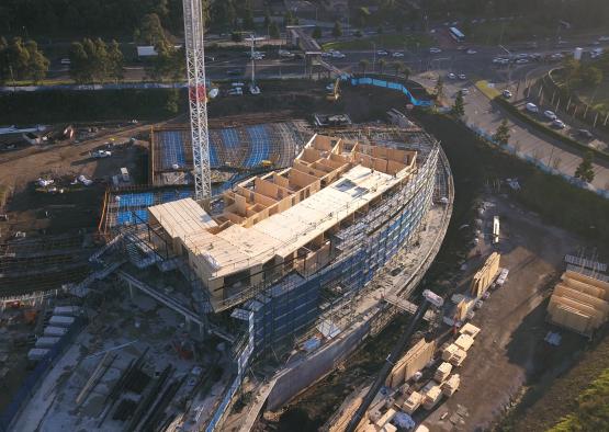 a building under construction with a crane