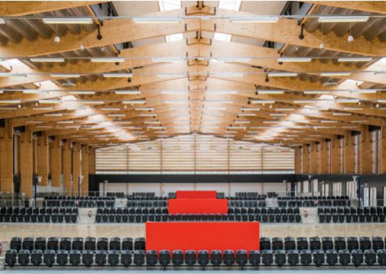 a large room with black chairs and a red box
