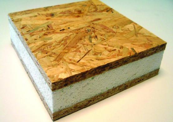a square piece of wood with white foam