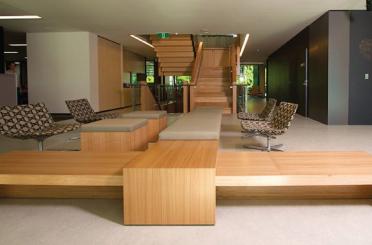 a long wooden bench in a room