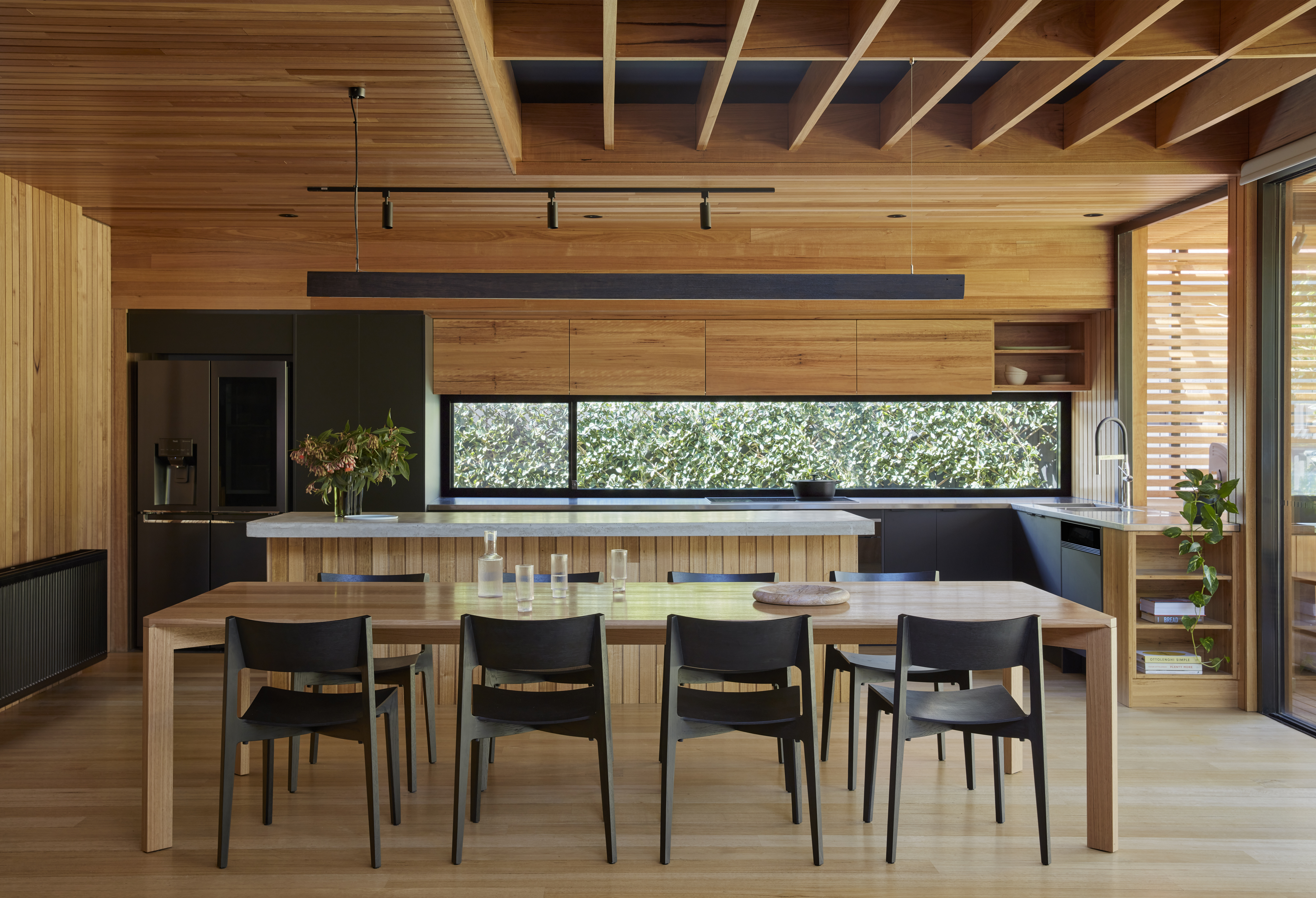 a dining table and chairs in a room