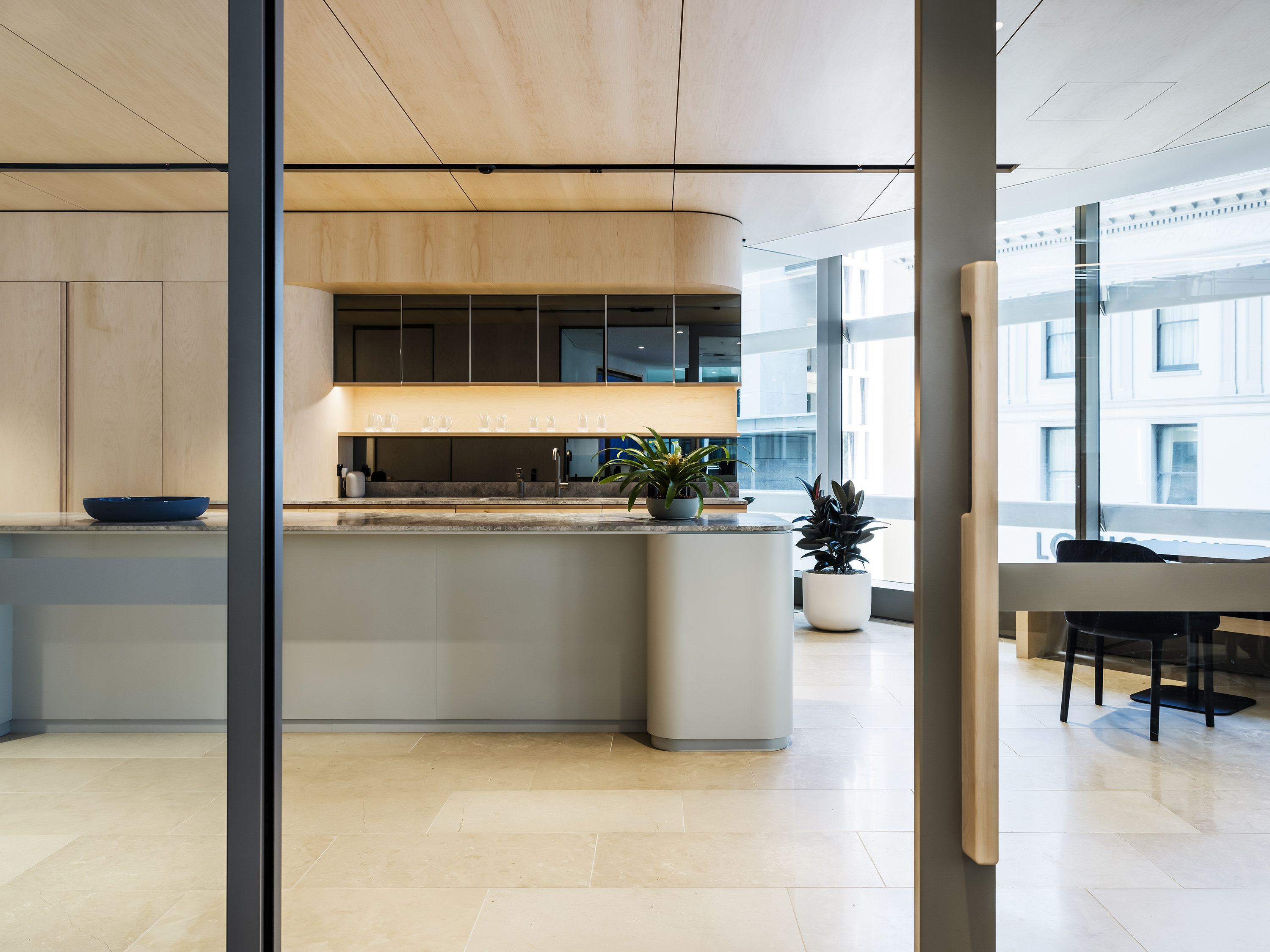 a kitchen with a glass door
