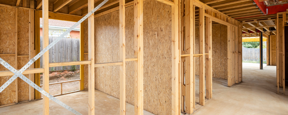 looking inside a timber framed house being built