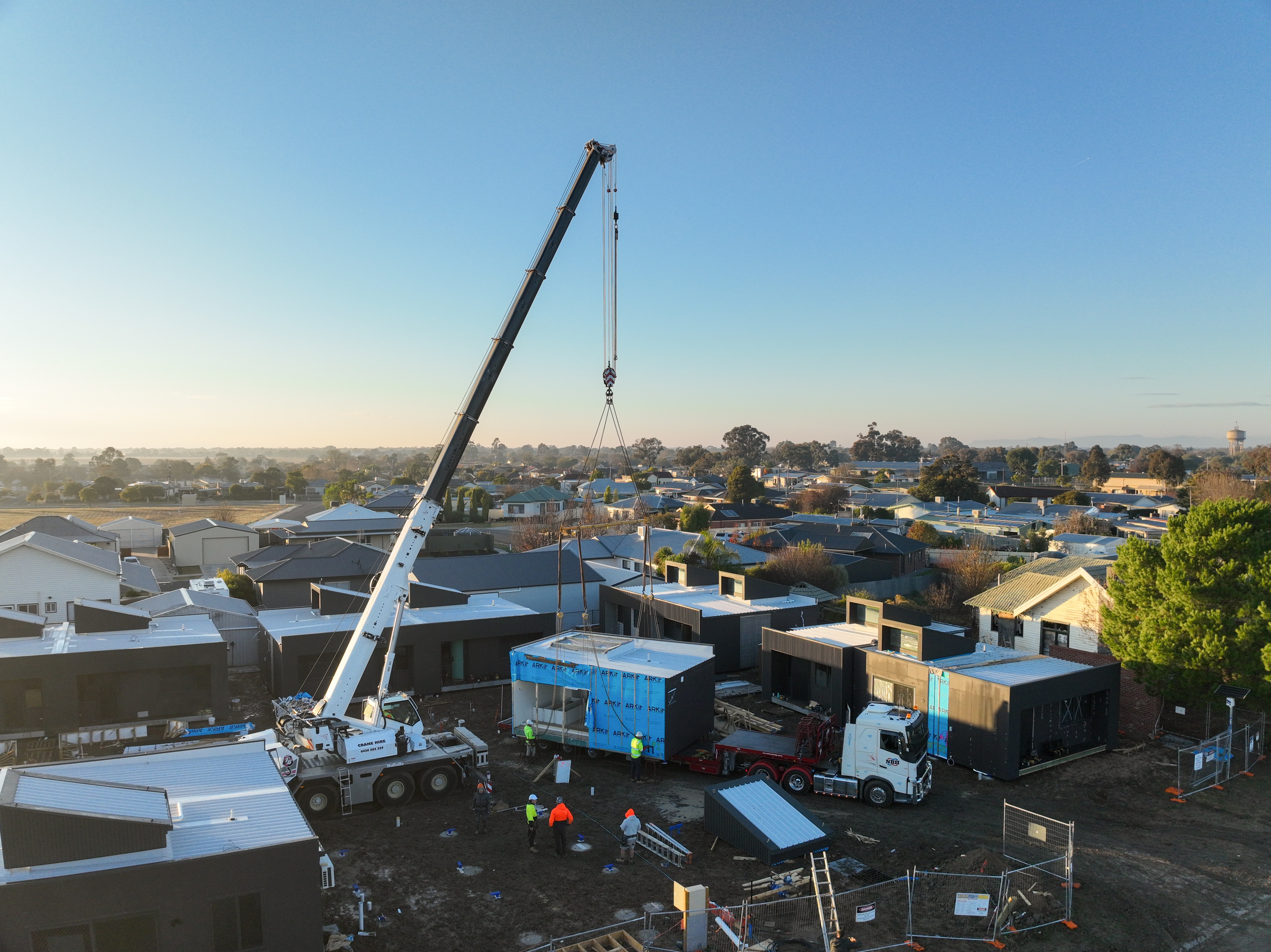Crane dropping in modular home sections
