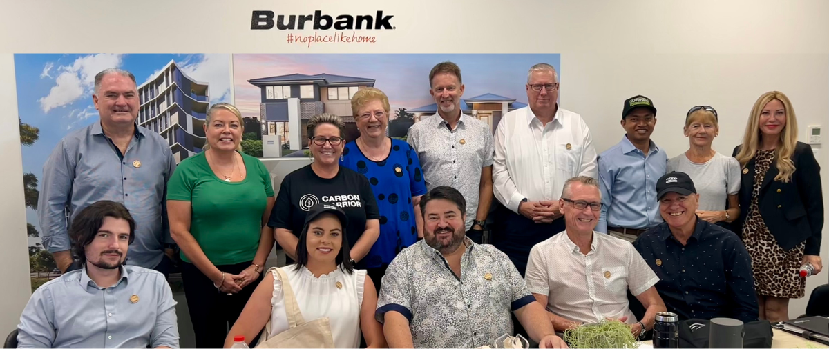 Collection of people in front of Burbank signage
