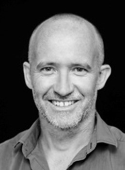 a man smiling for a picture