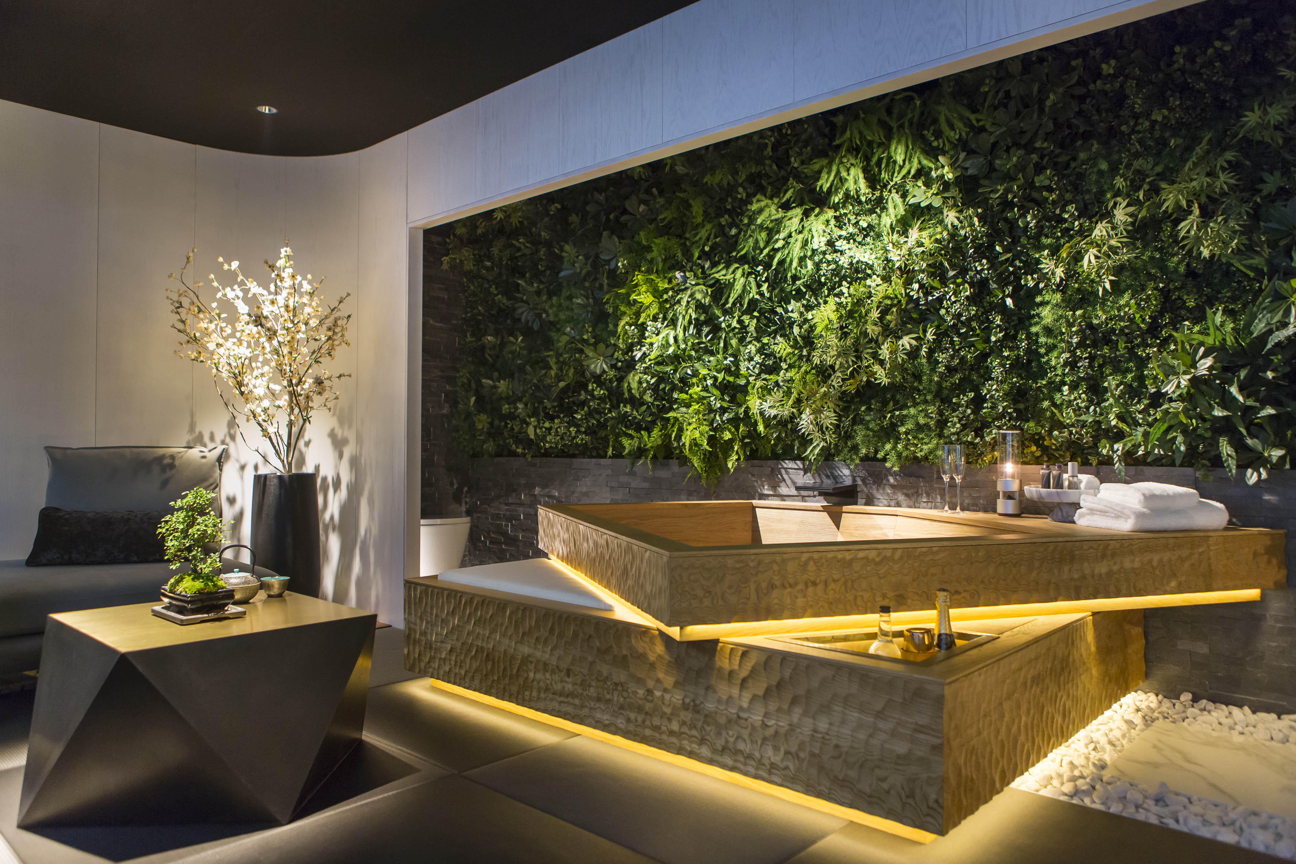 a room with a jacuzzi and plants