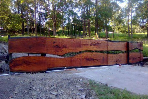 a wood fence with trees in the background
