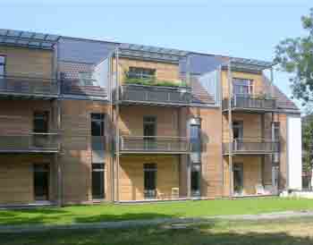 An apartment building with a refurbished, prefabricated modular timber facade by Arthur Schankula Architects, Munich