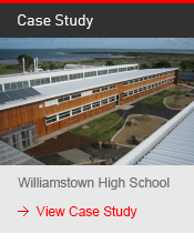 a building with a roof and a view of the ocean