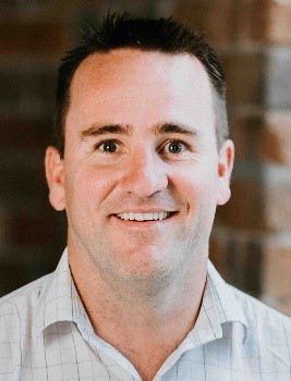 a close-up of a man smiling