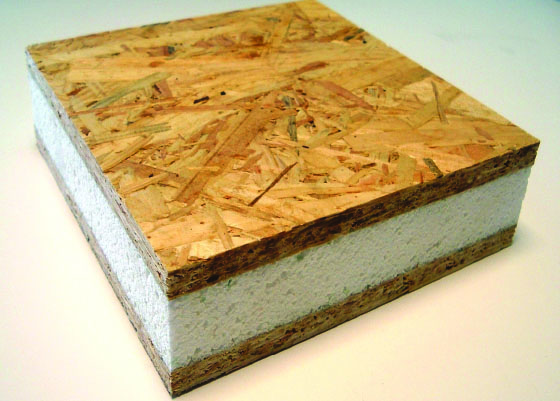 a square piece of wood with white foam