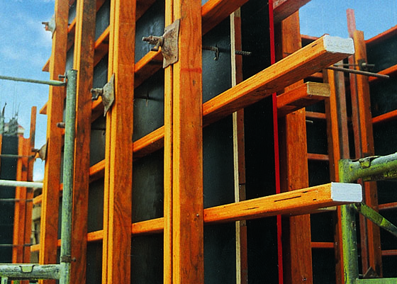 a wooden structure with metal rods