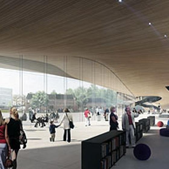 The dynamic wooden roof undulates over the inviting main entry to the proposed Helsinki Central Library by ALA Architects