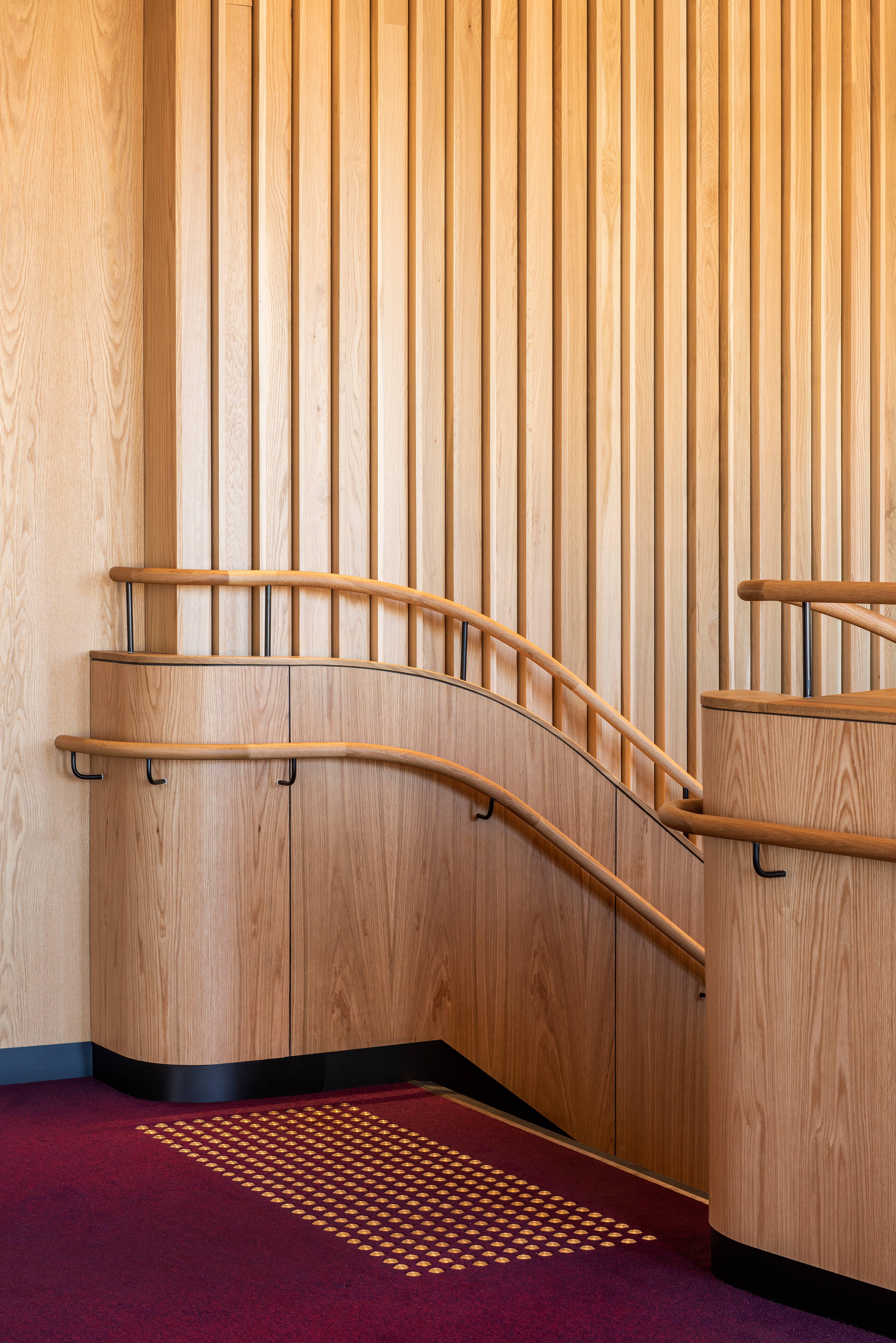 a wooden staircase with handrails