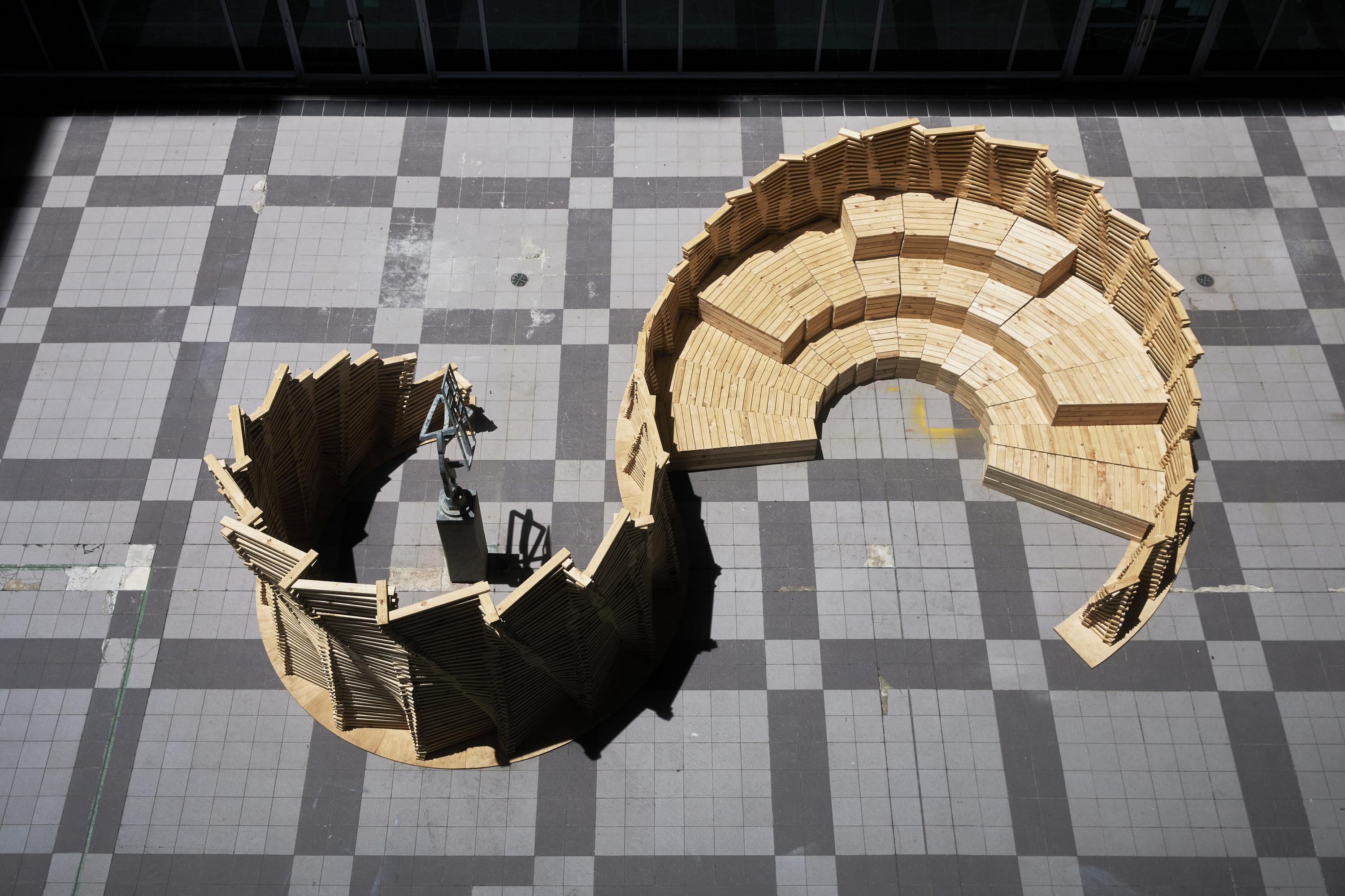 a wooden structure on a tile floor