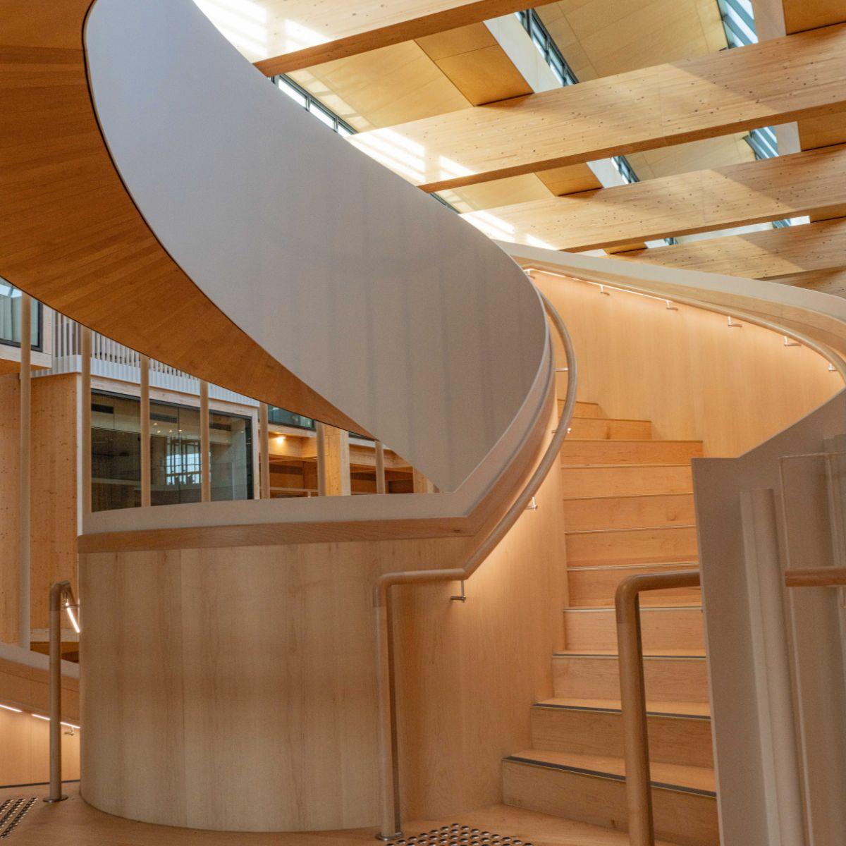 Photo of interior timber stairwell, Michael Kirby Building, Macquarie Law School