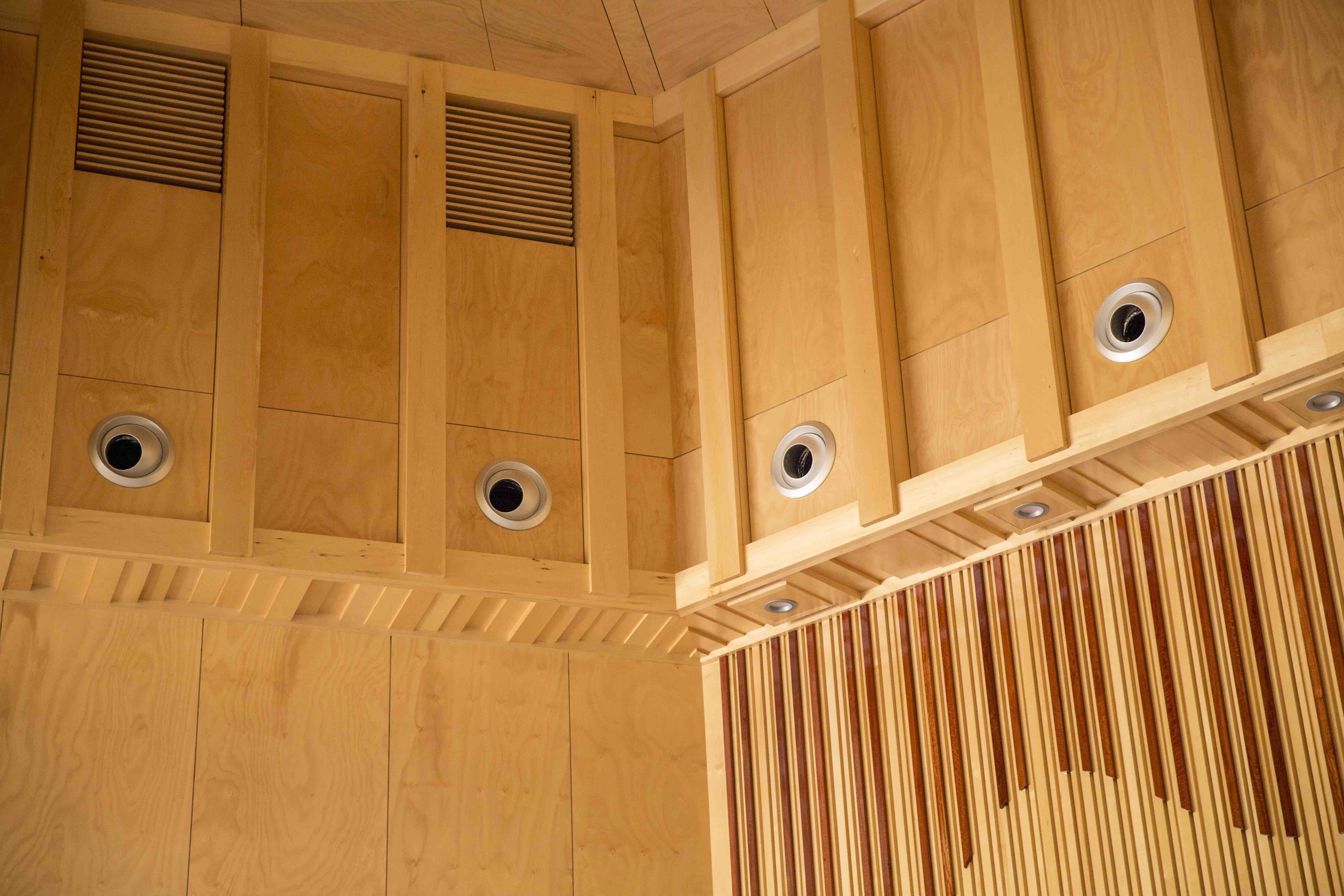 a wood paneled ceiling with holes in the ceiling