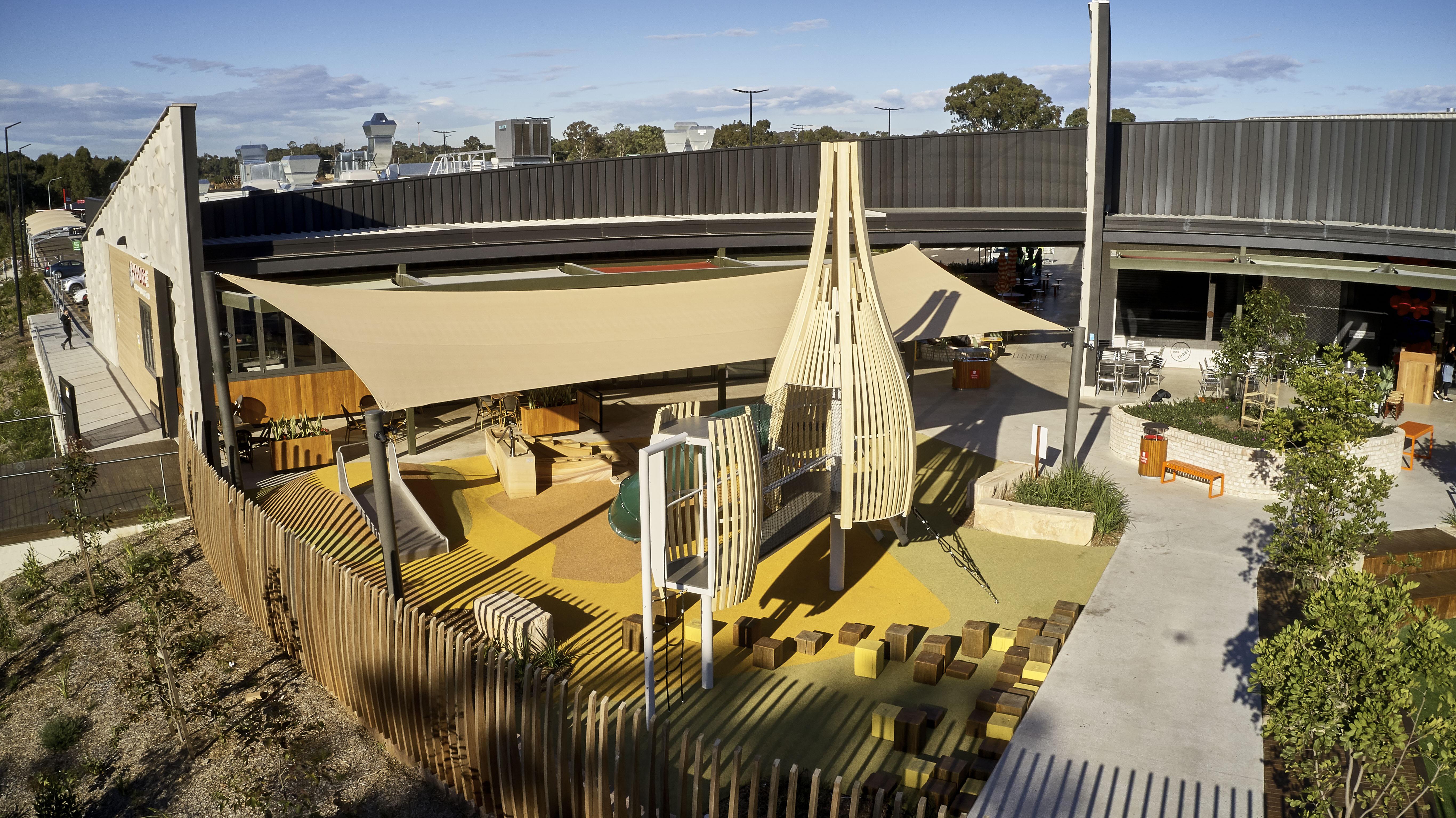 a playground with a wooden structure
