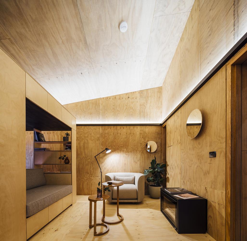 a room with a couch and a lamp