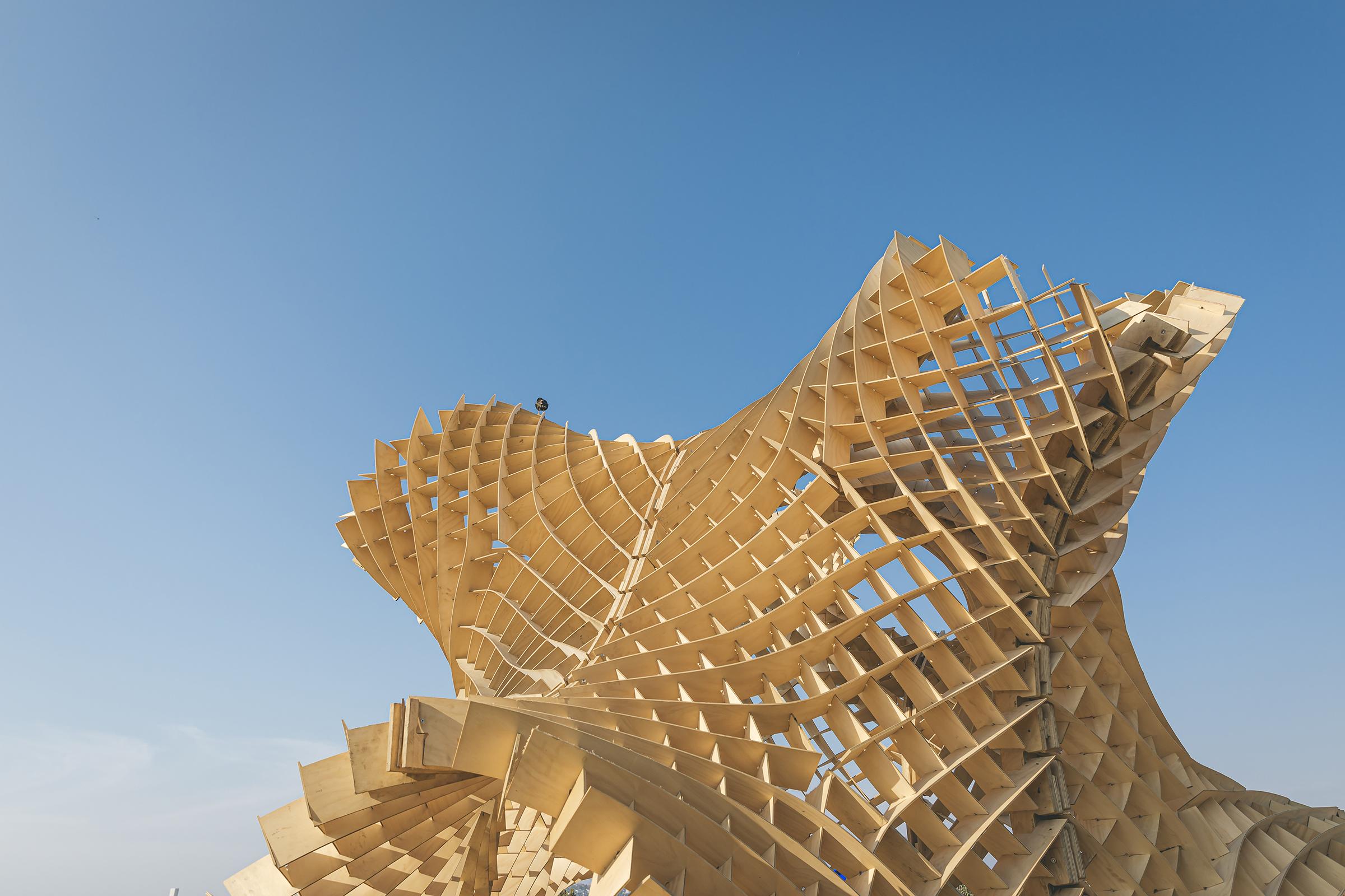 a wooden structure with a blue sky