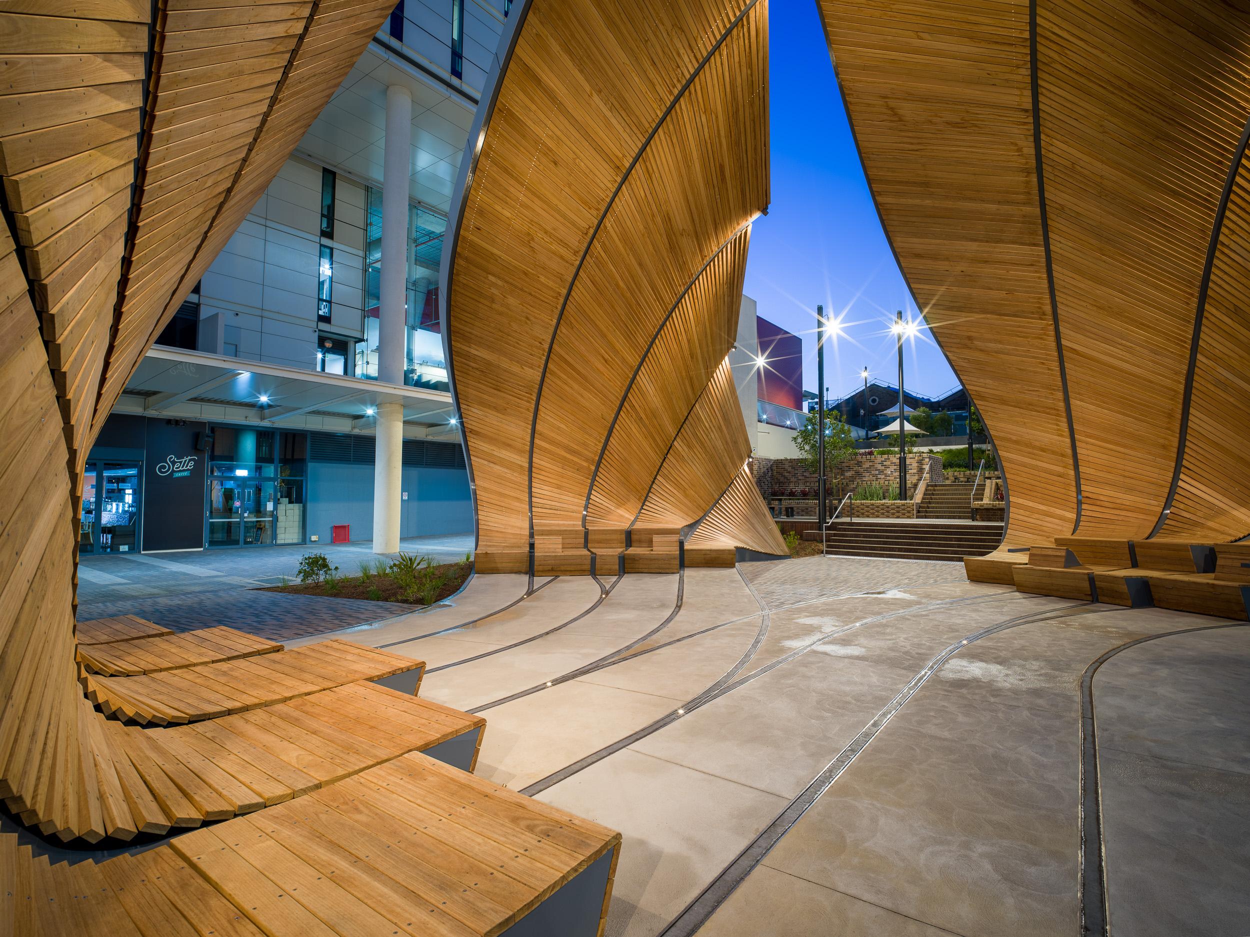 a wooden structure with curved walls