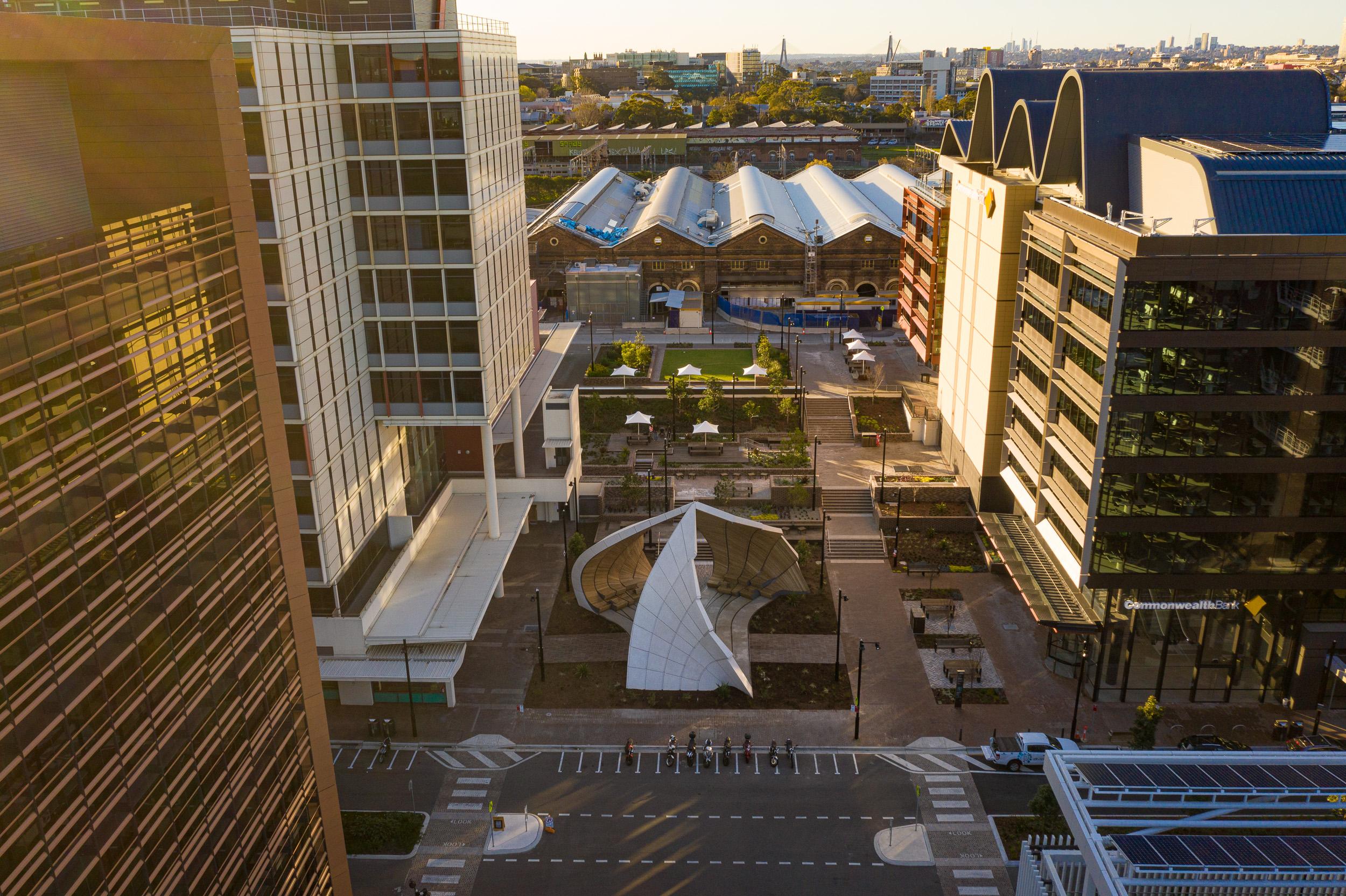 a city with buildings and a large structure