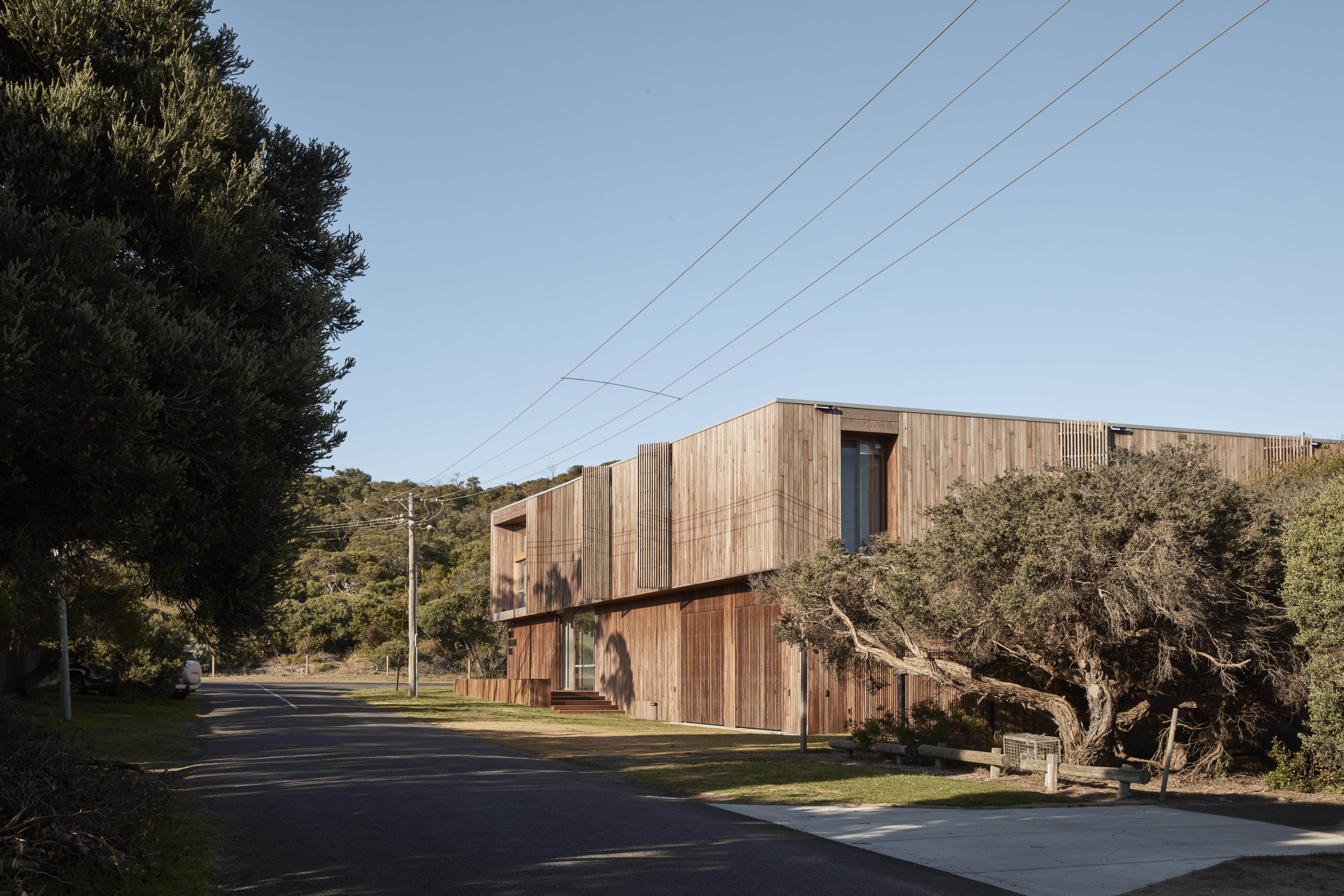 a building with trees and power lines