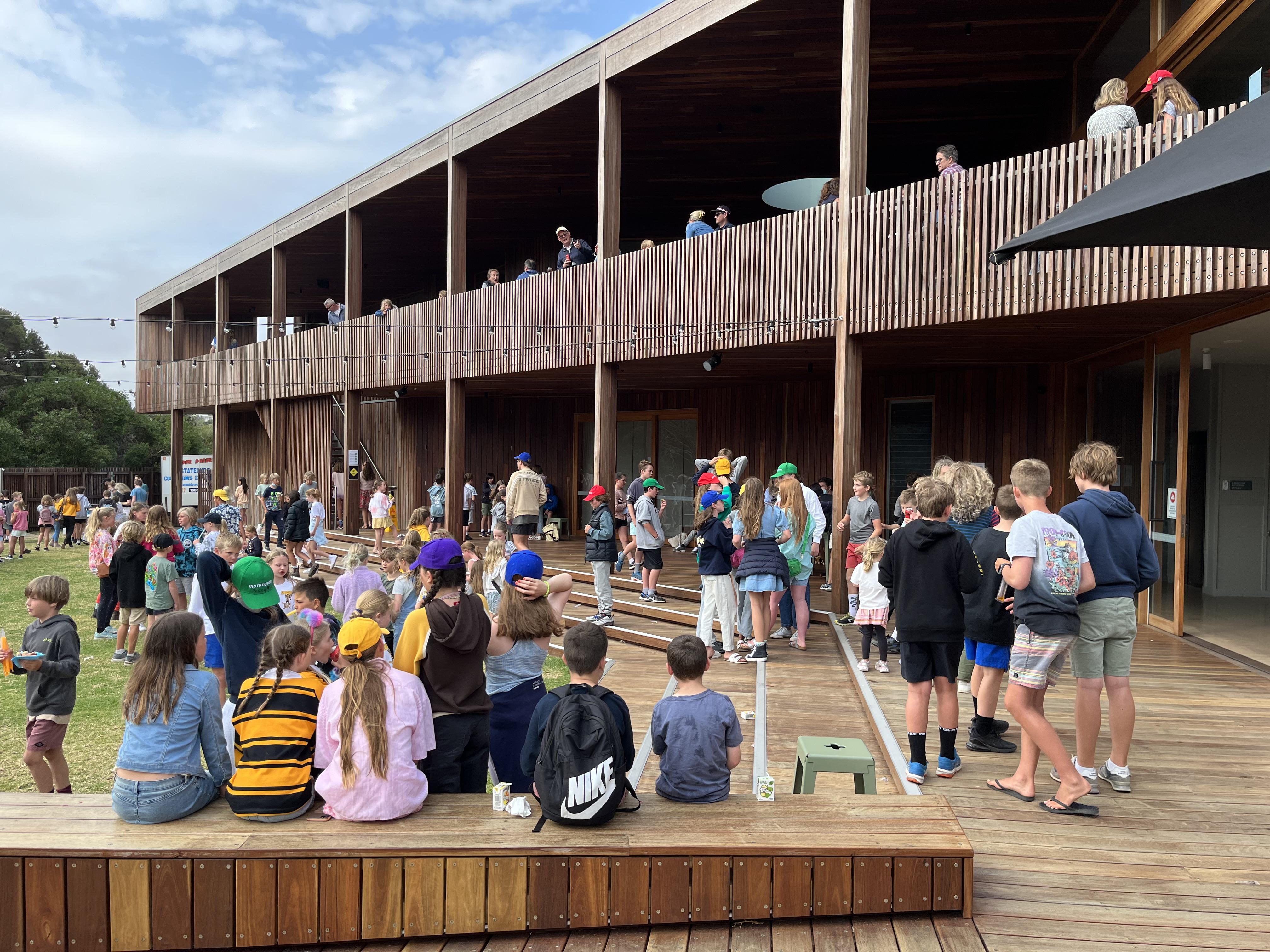 a group of people sitting on a deck