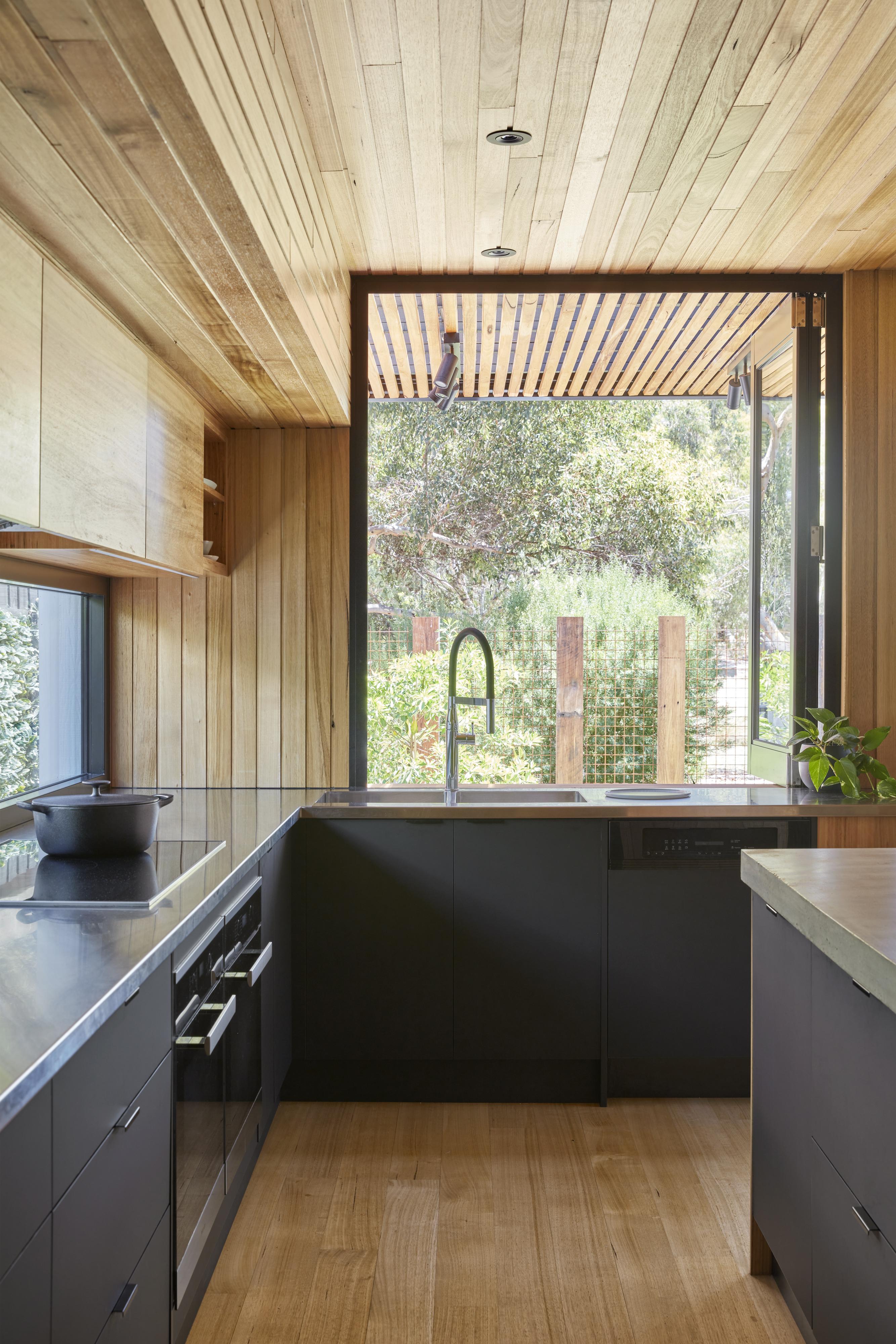 a kitchen with a large window