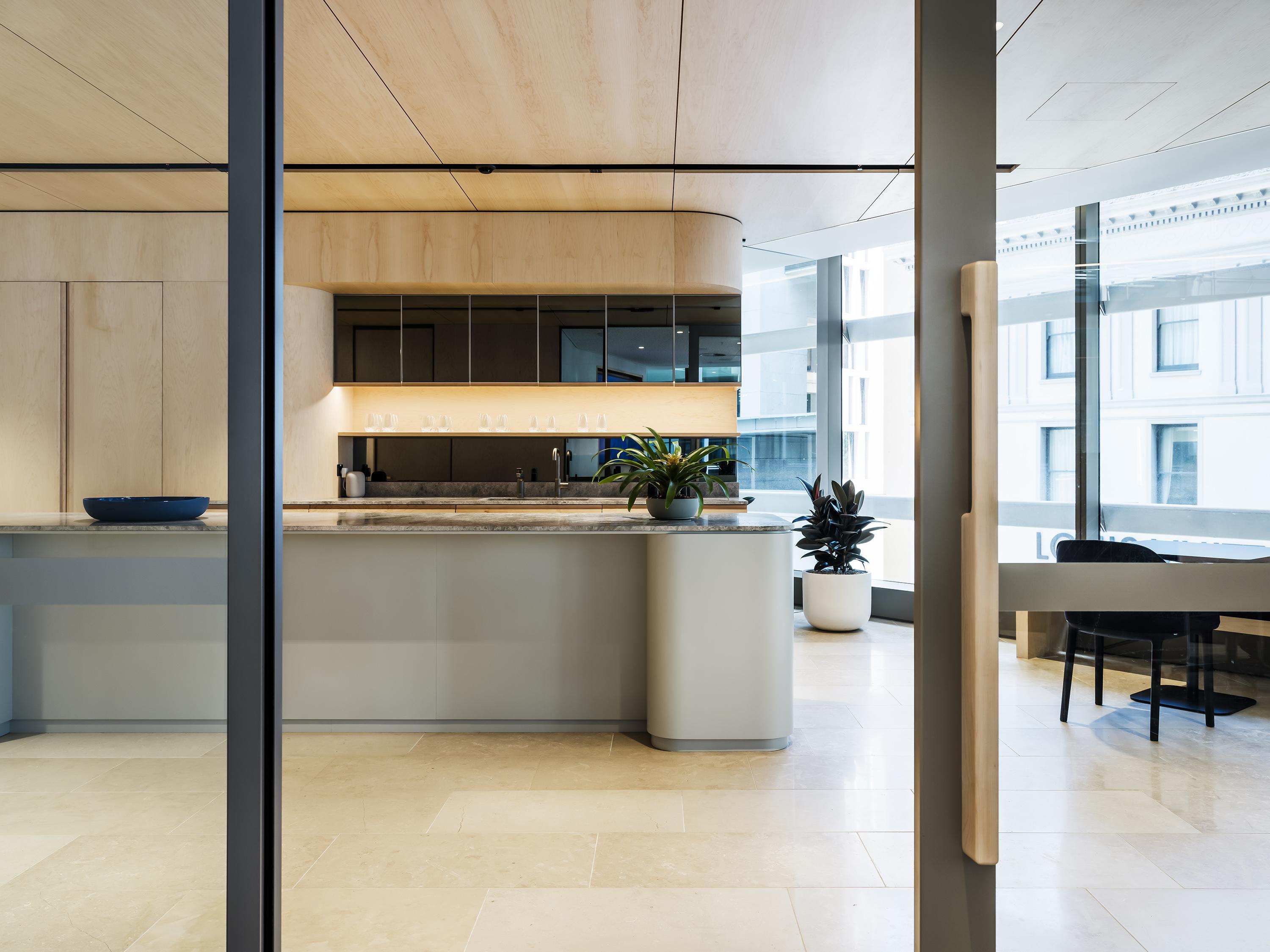 a kitchen with a glass door