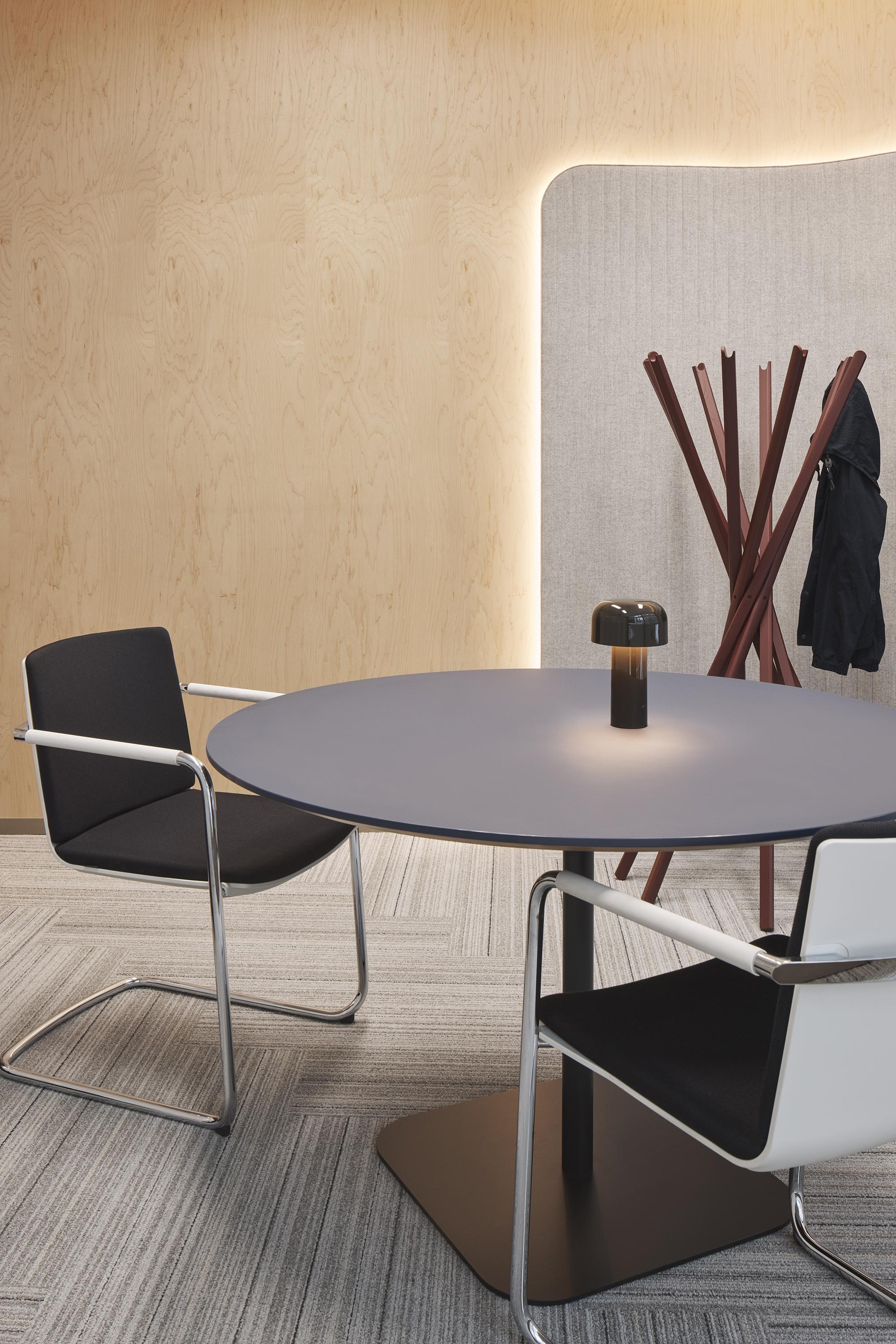 a table with chairs in a room