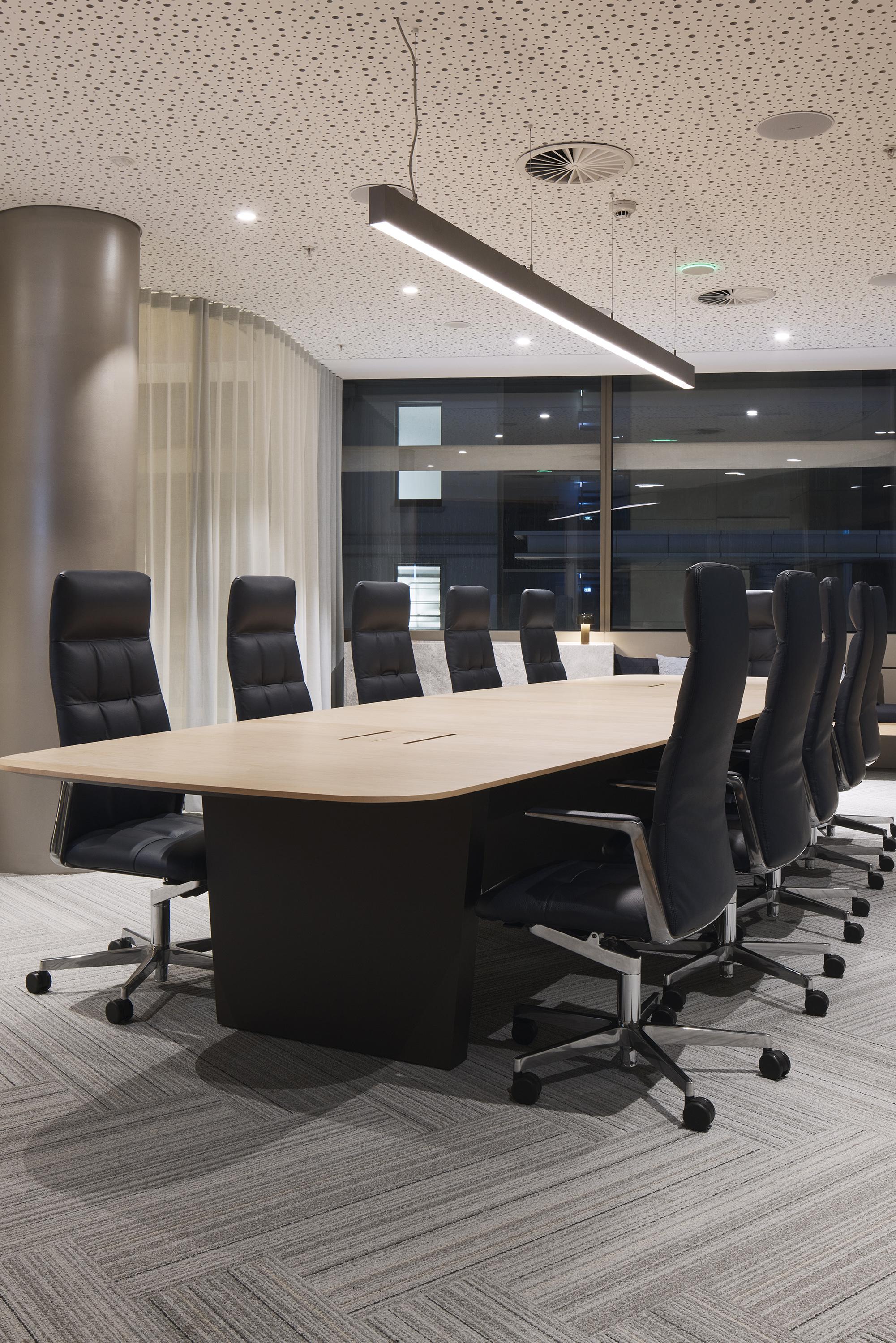 a conference table with chairs in a room