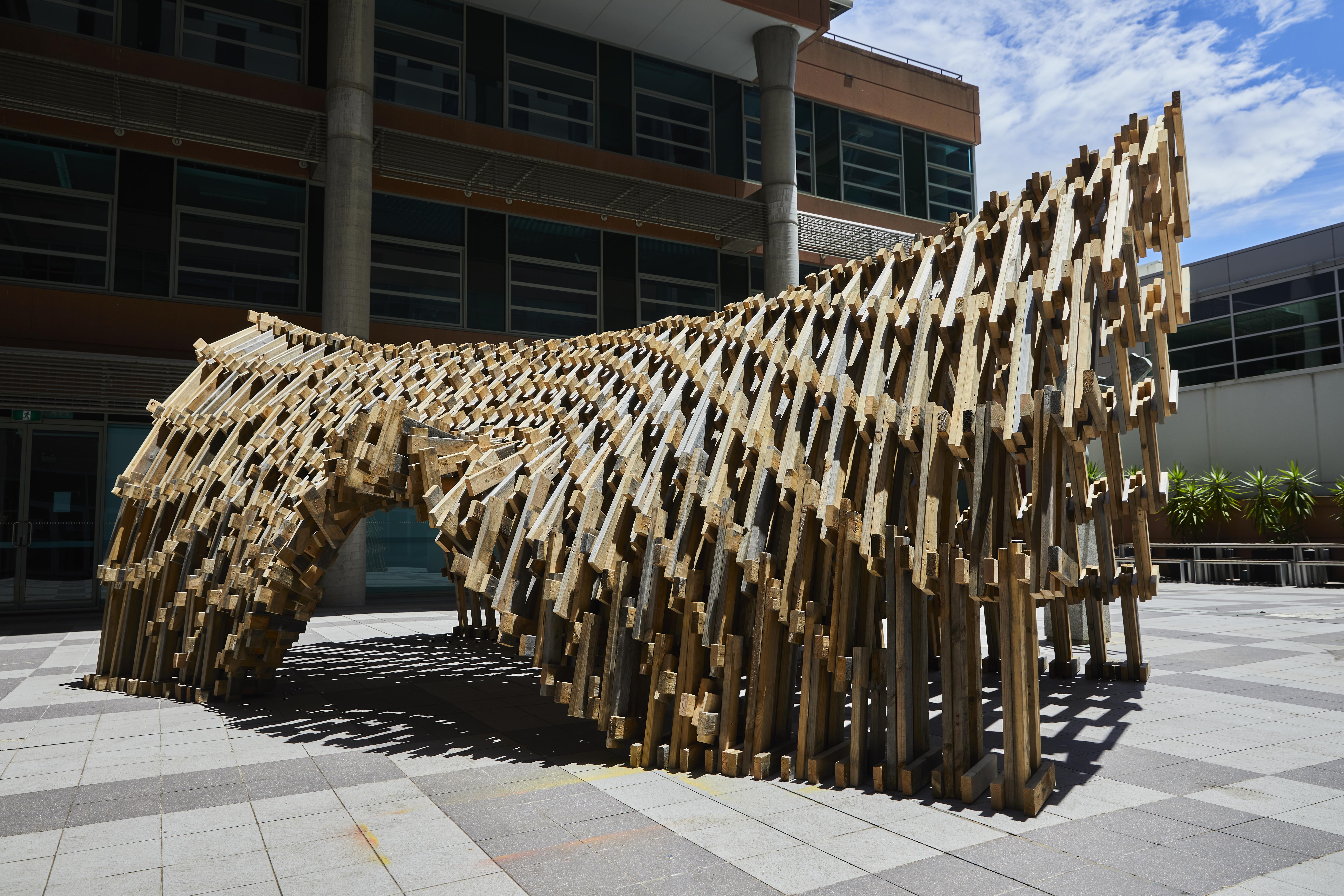 a sculpture of a horse made of wood