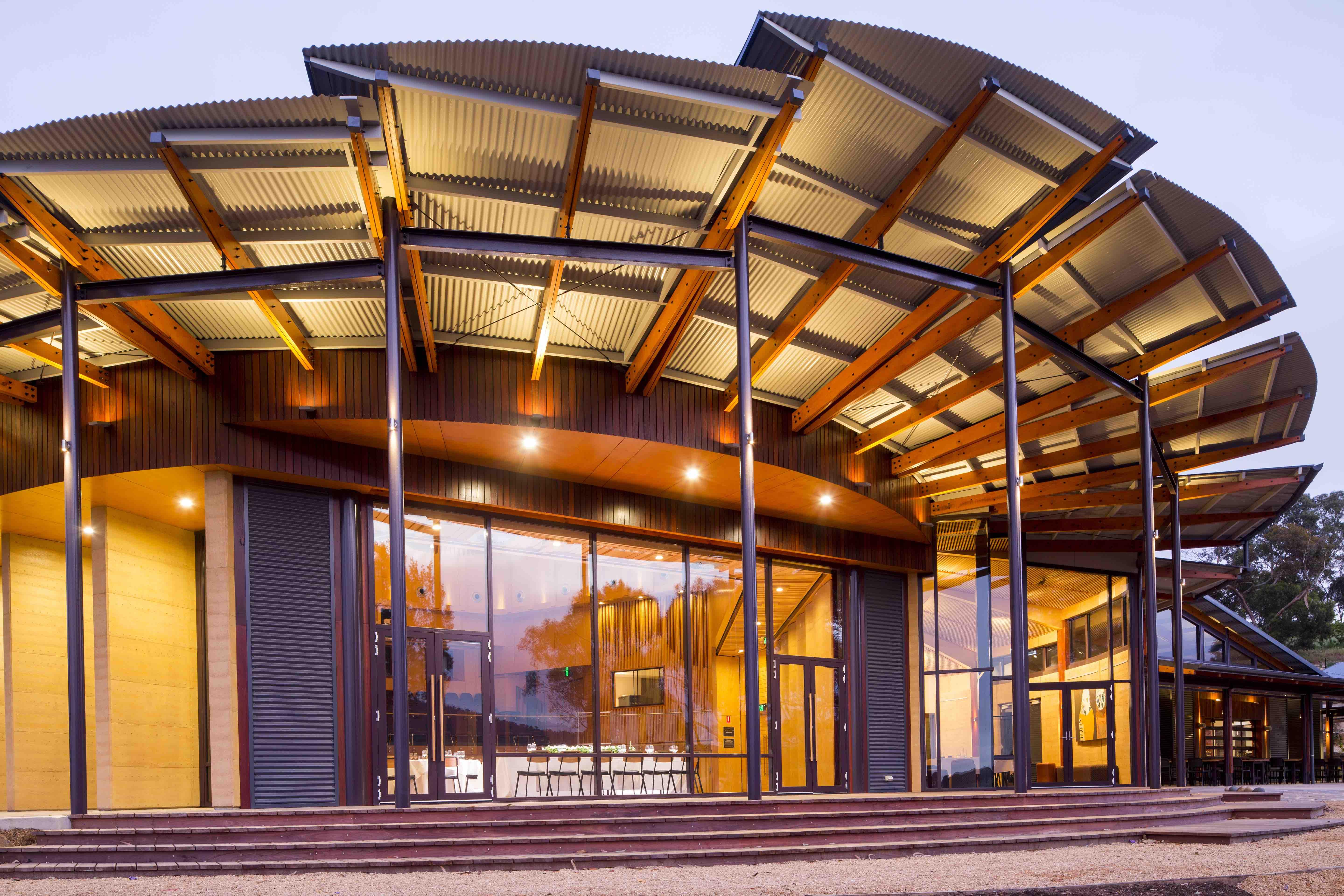 a building with a roof and glass doors
