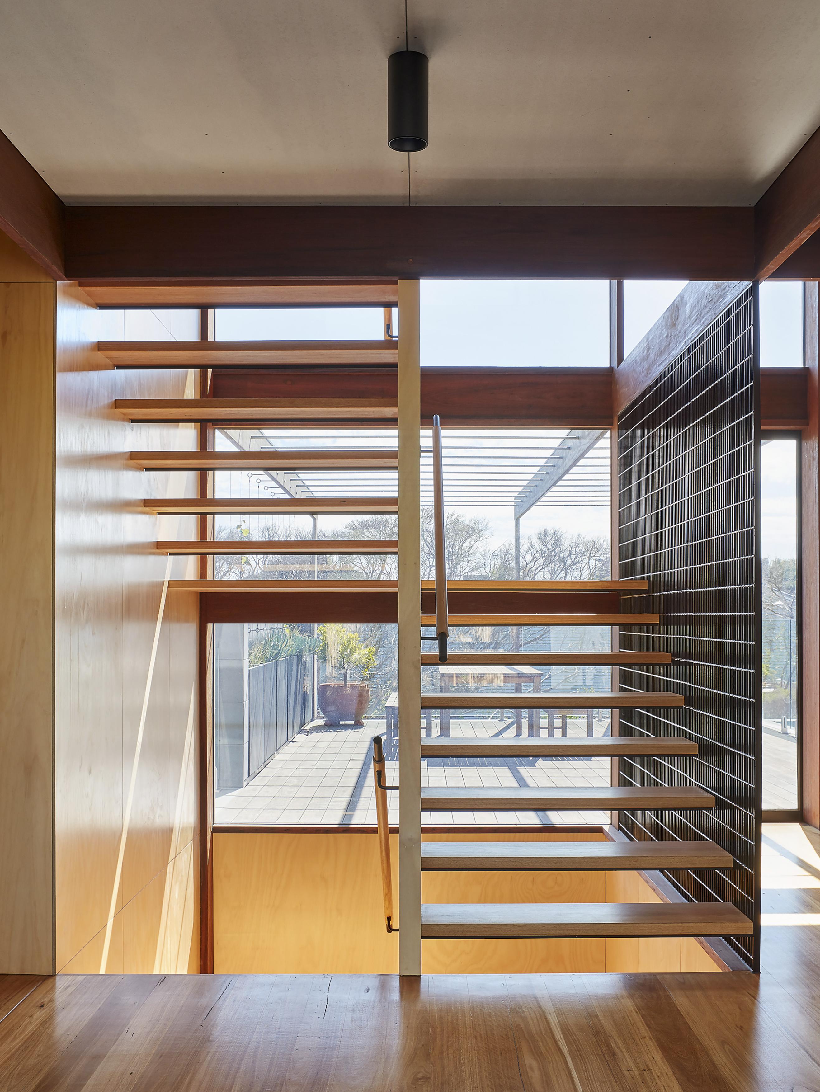 a staircase in a room with a window