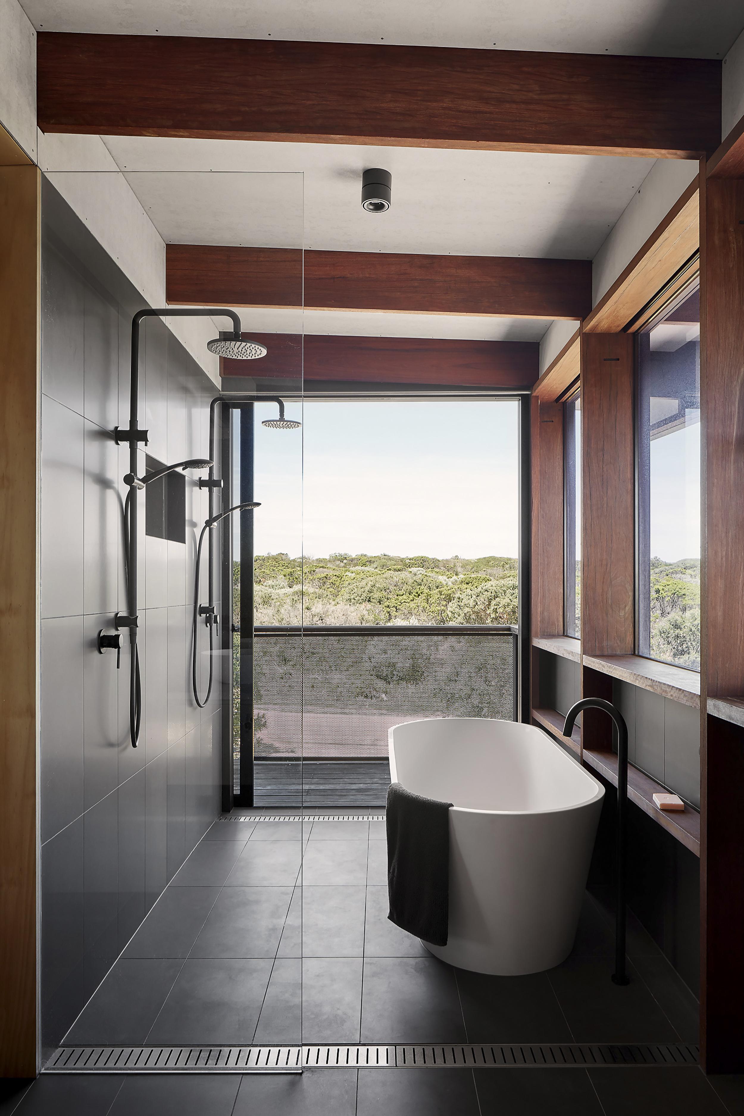 a bathroom with a tub and shower