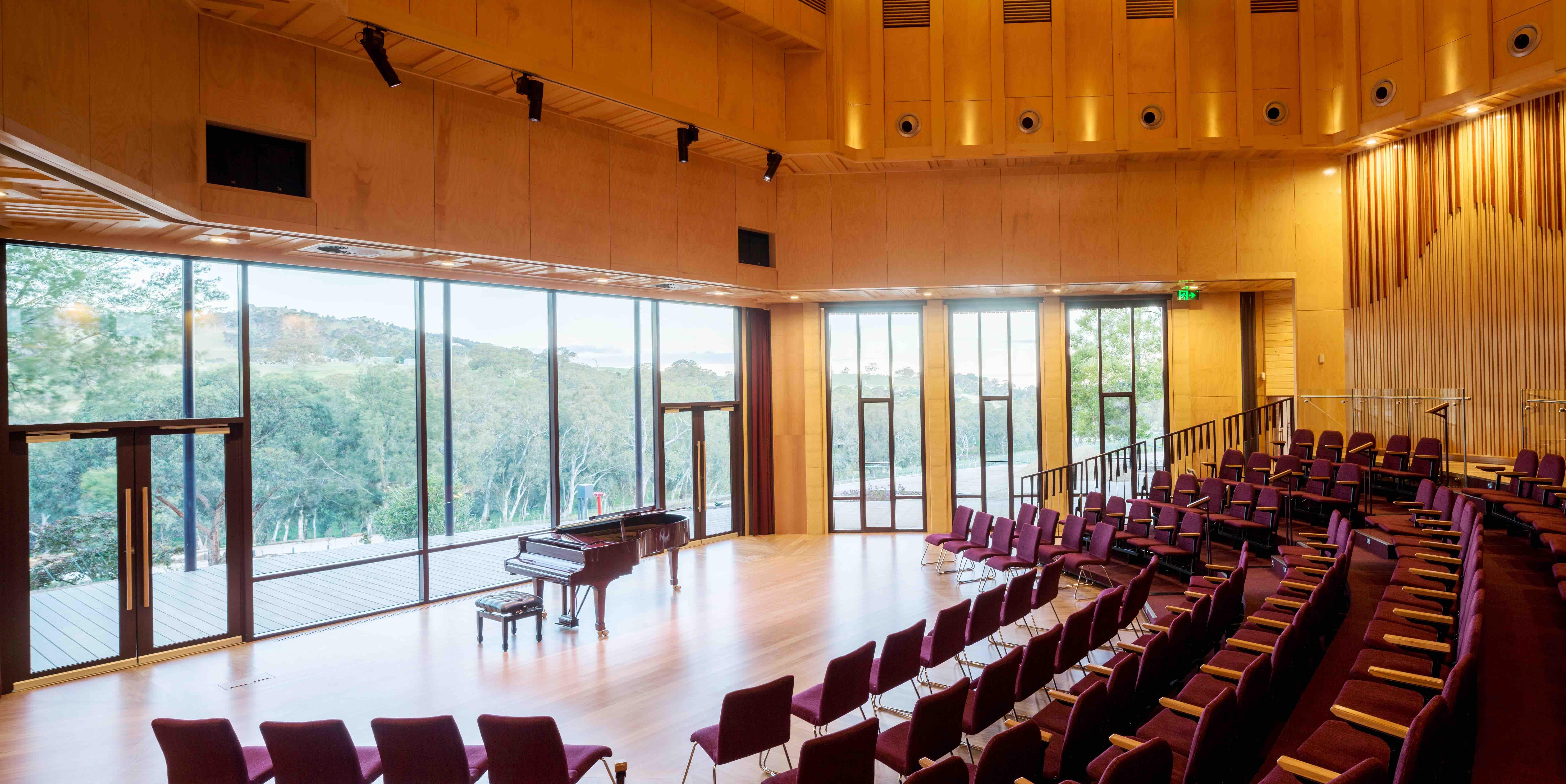 a room with a piano and chairs