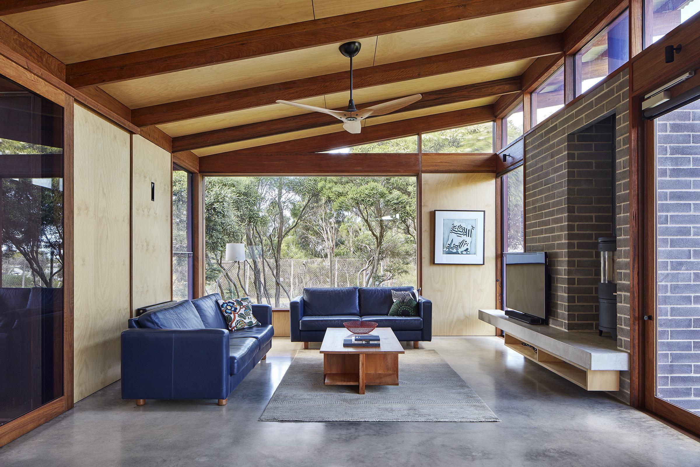 a living room with a fireplace and couches