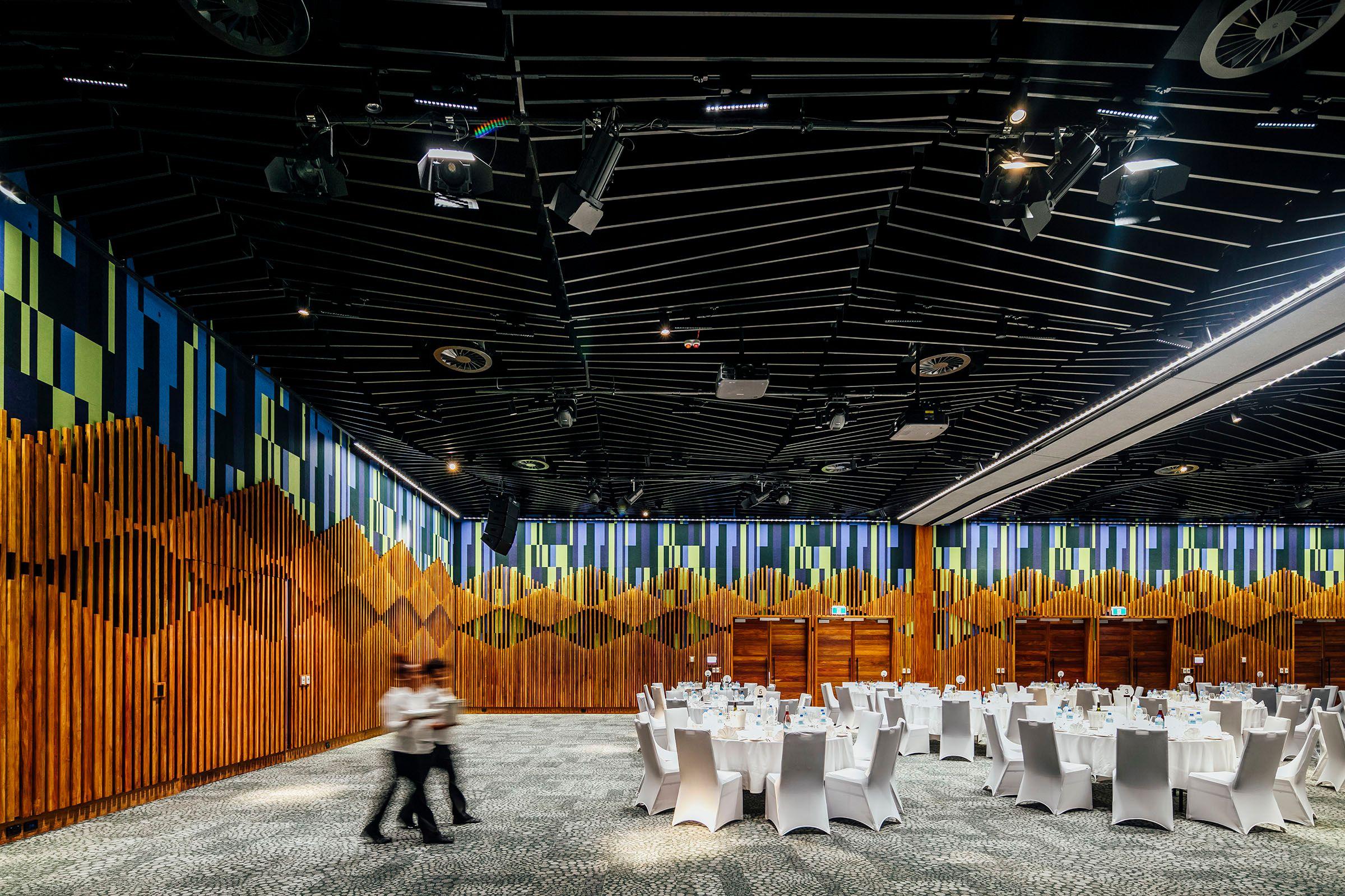 a room with white tables and chairs