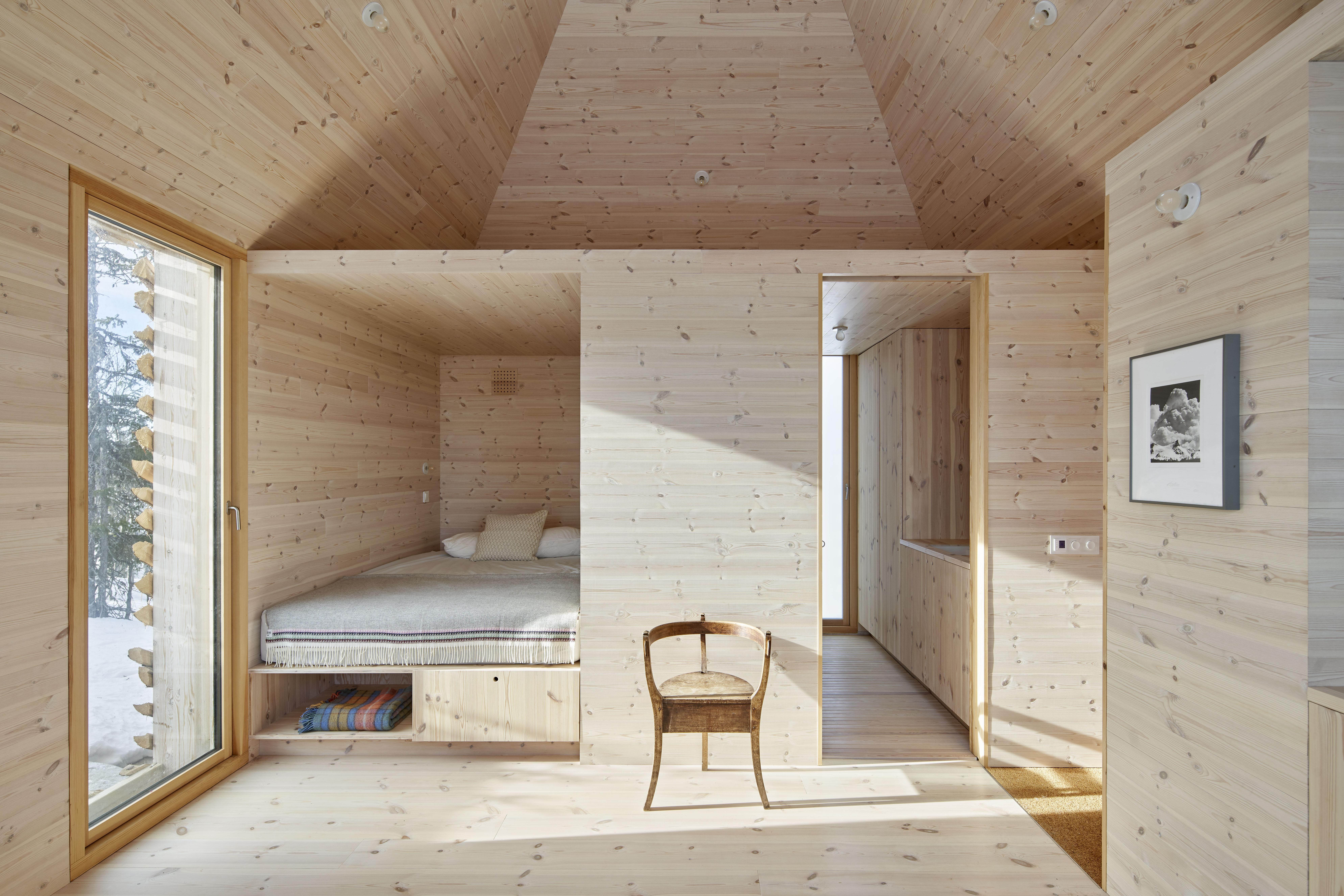 a room with a bed and a chair