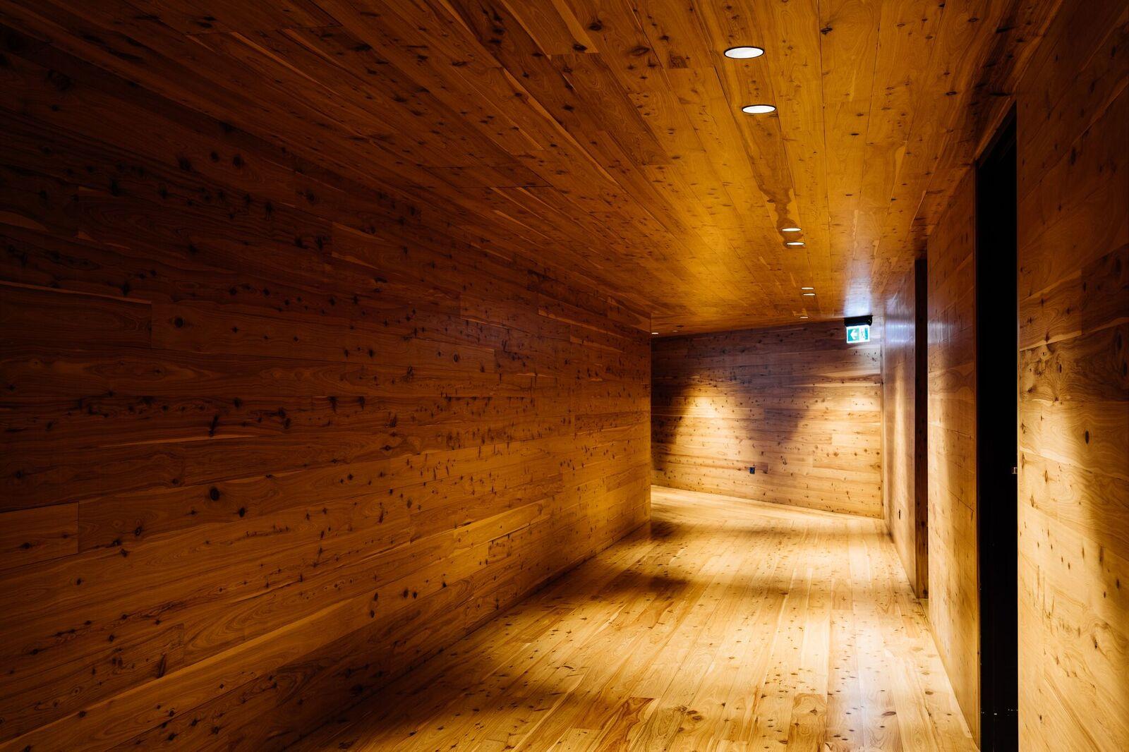 a wooden hallway with lights
