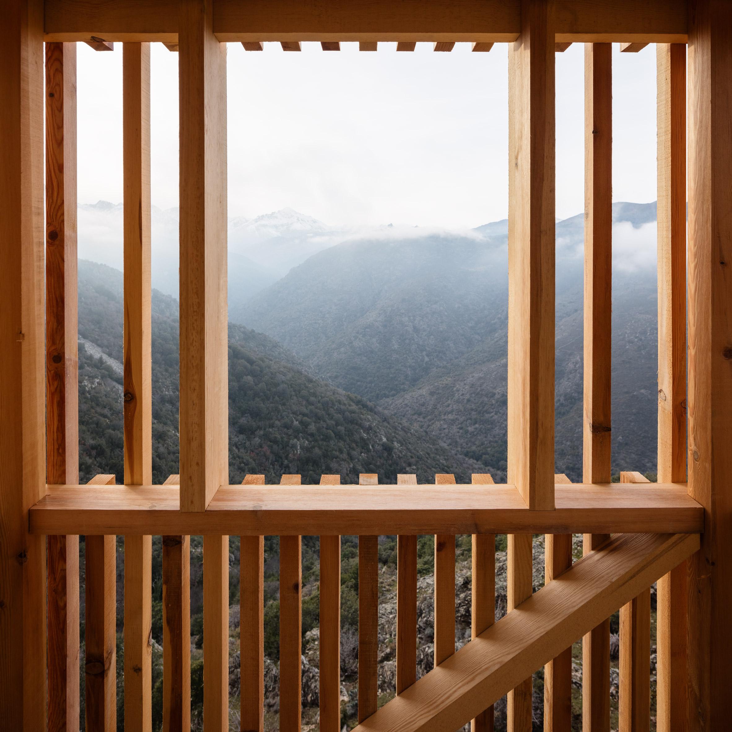 a view of mountains from a window