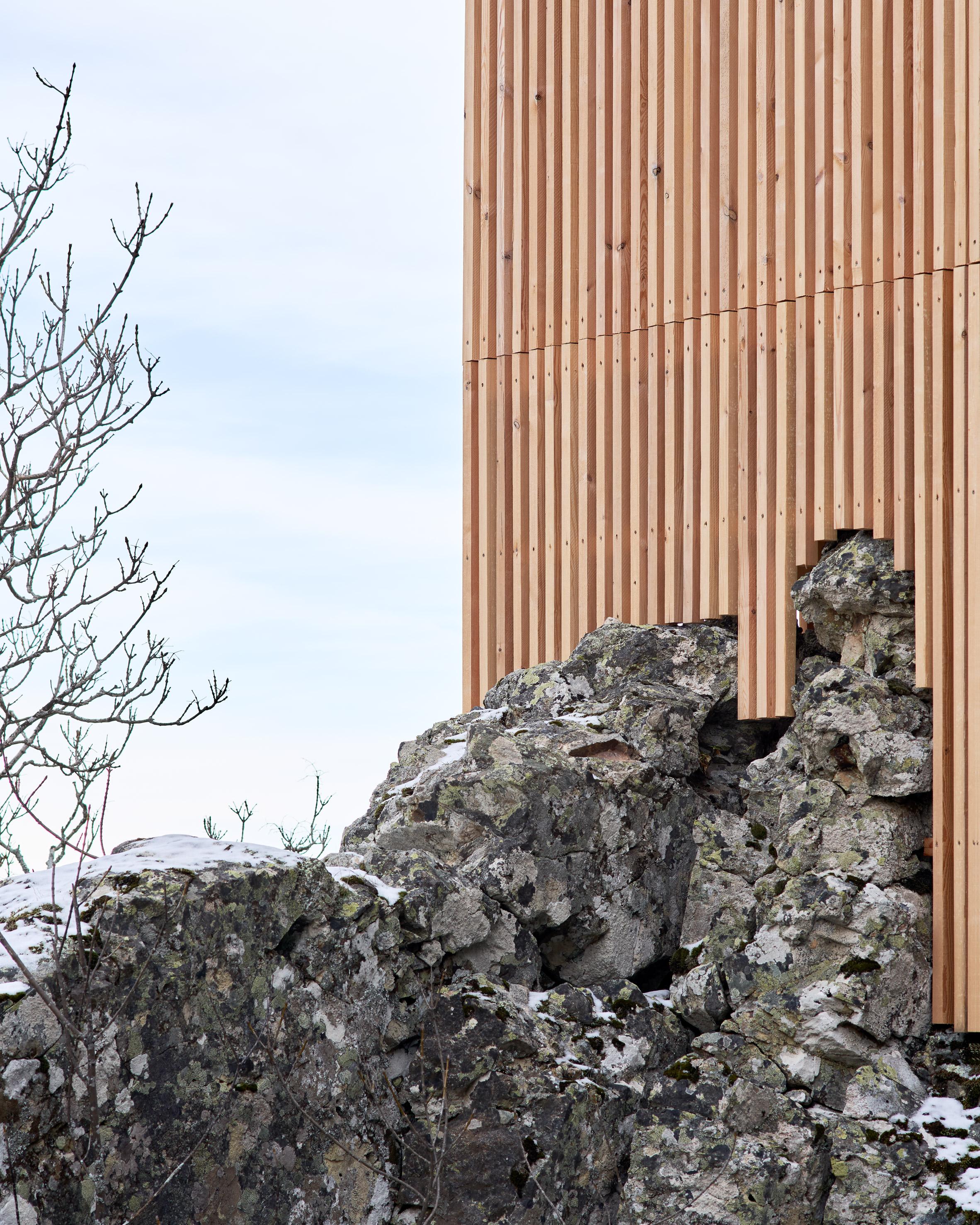 a building with a pile of rocks