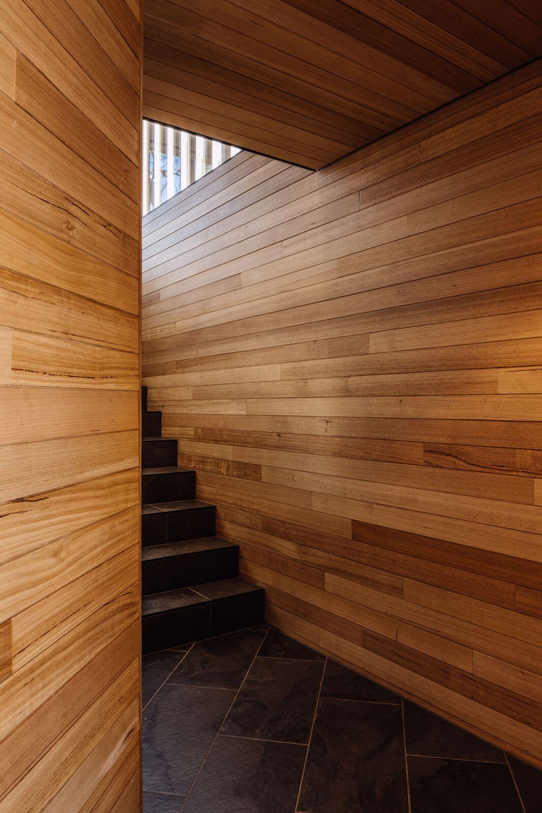 a staircase in a wood room