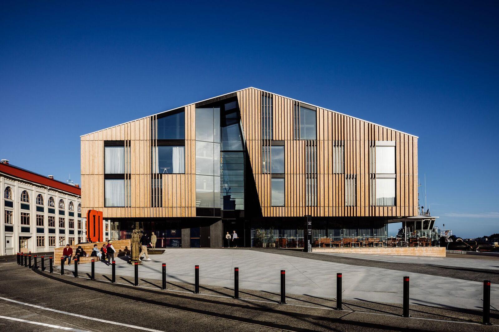 a building with a triangular shaped roof