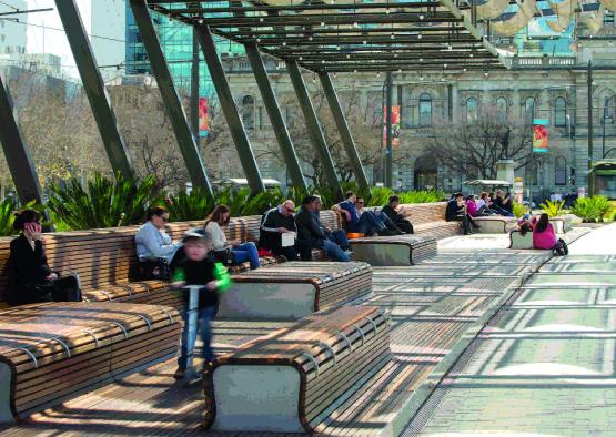 a group of people sitting on benches