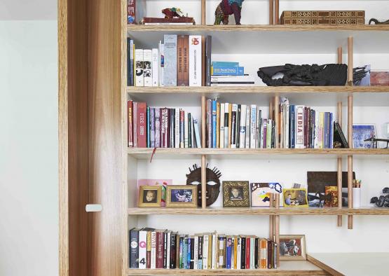 a shelf with books and toys